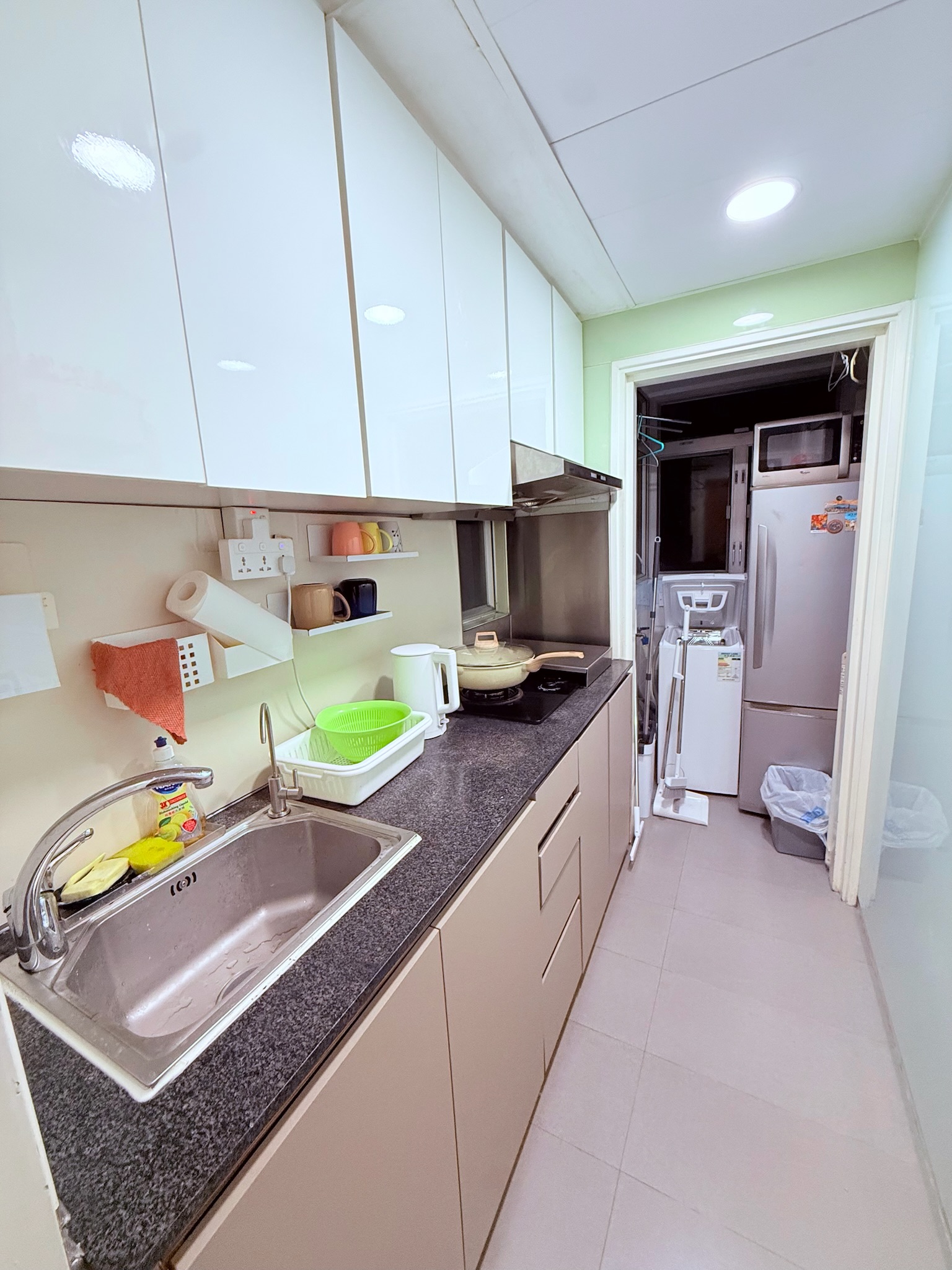 Galley kitchen with full appliances