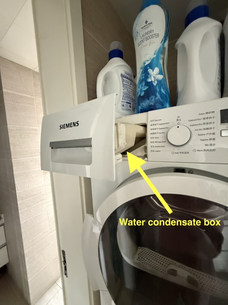 Water-condensate box at the upper left of the dryer